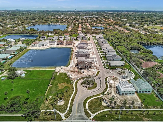 birds eye view of property featuring a water view