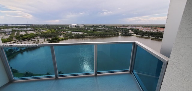 balcony featuring a water view