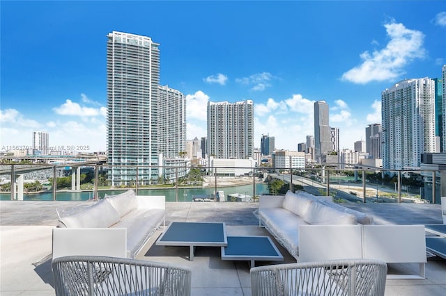 view of patio featuring a water view and an outdoor hangout area