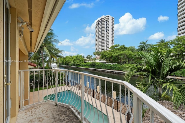 balcony featuring a water view