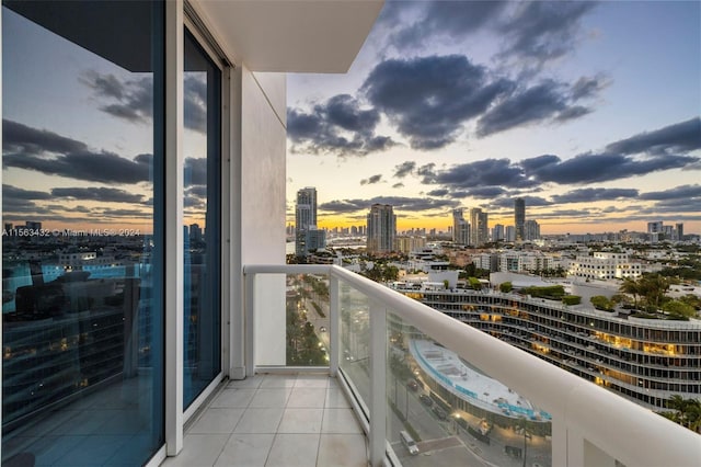 balcony at dusk with a view of city