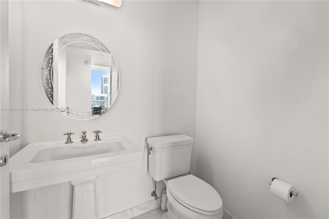 bathroom featuring toilet and a sink