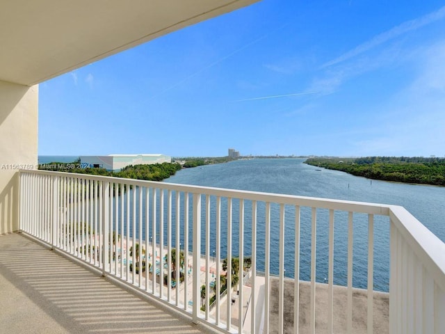 balcony featuring a water view