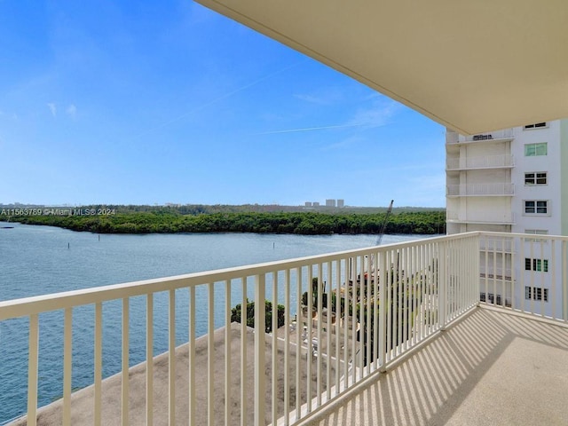 balcony featuring a water view