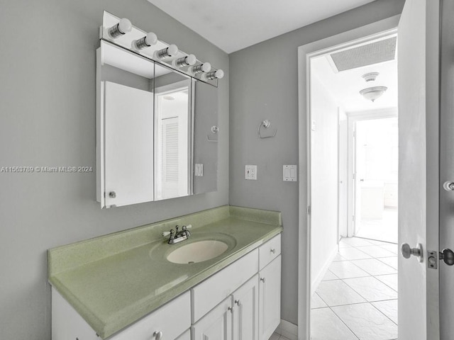 bathroom with vanity and tile floors