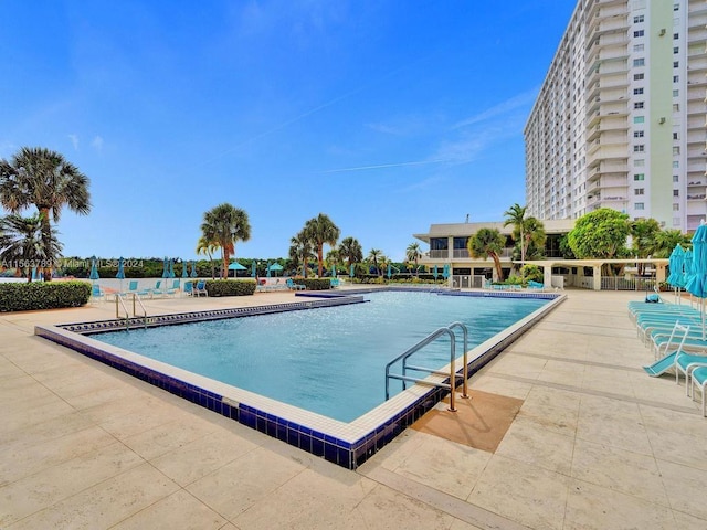 view of swimming pool featuring a patio area