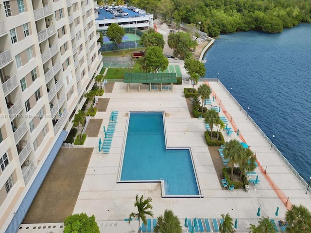 view of swimming pool featuring a water view