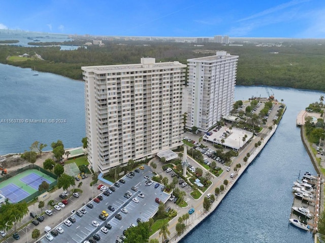 birds eye view of property with a water view