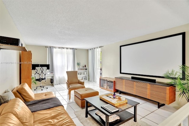 home theater room with light tile patterned flooring and a textured ceiling