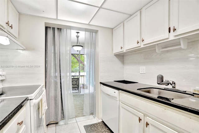 kitchen featuring light tile patterned flooring, white appliances, sink, and white cabinetry