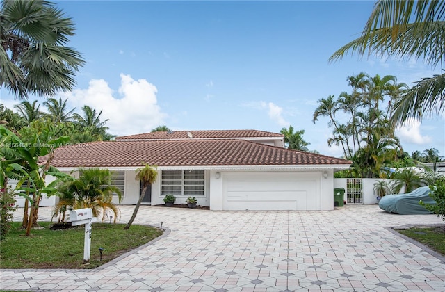 mediterranean / spanish house featuring a garage