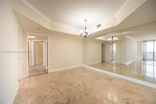 tiled spare room with a raised ceiling and an inviting chandelier