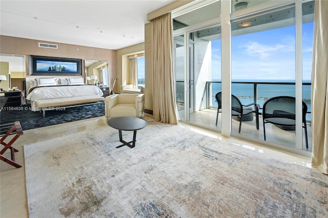 bedroom featuring a water view