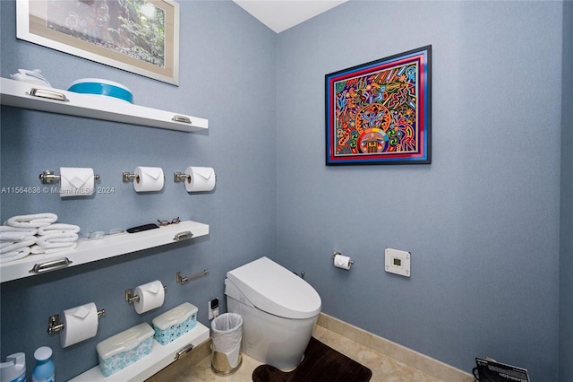 bathroom with tile floors and toilet