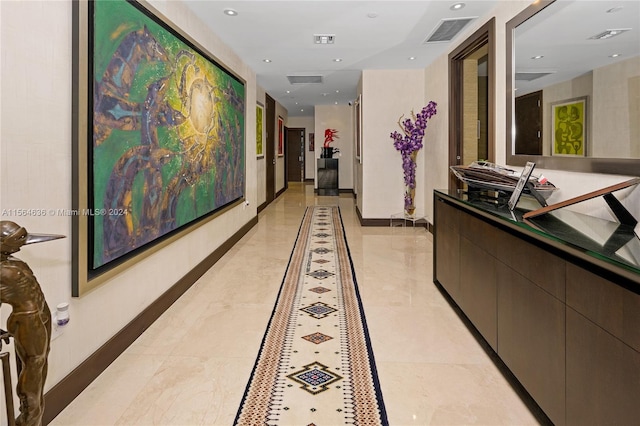 hallway with light tile floors