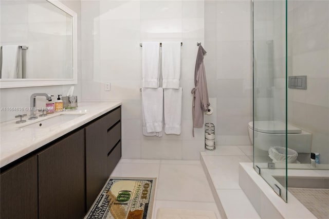 bathroom featuring tile flooring, toilet, and vanity