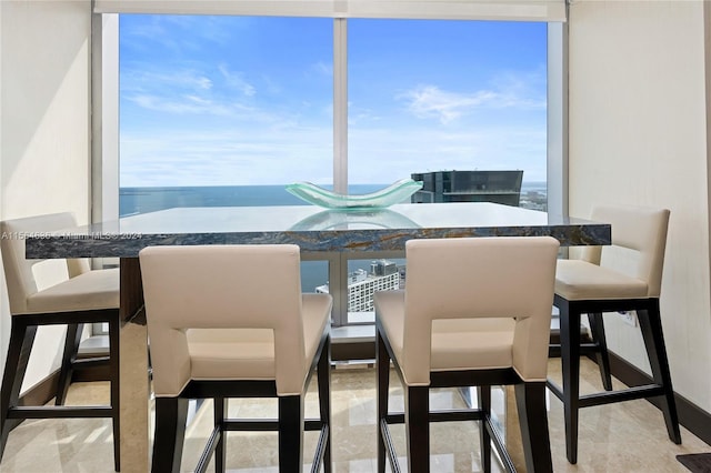 dining area featuring a water view