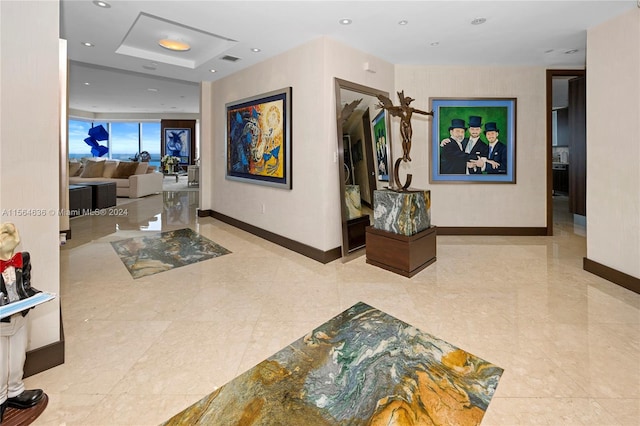 hall featuring light tile flooring