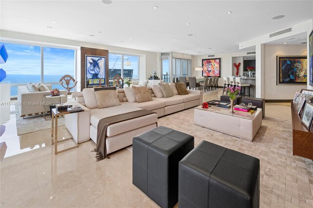 living room featuring light tile floors