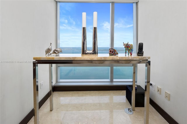 interior details with a water view and light tile flooring