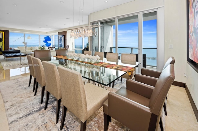 dining room featuring a water view