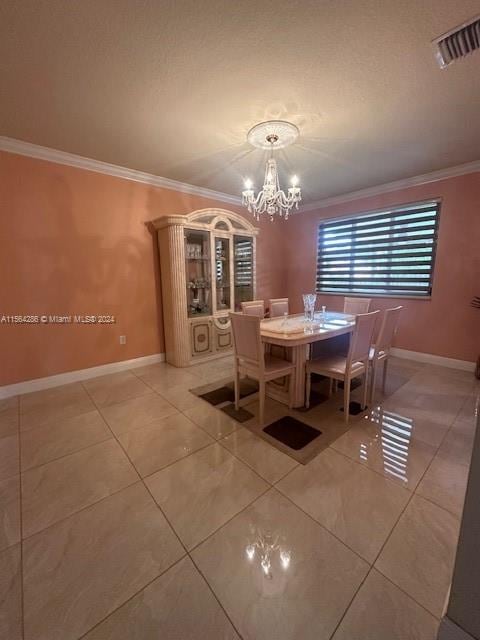 tiled dining room with crown molding and a chandelier