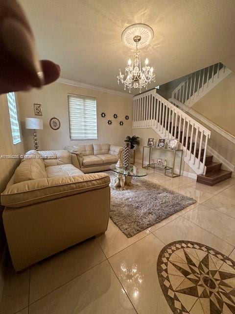 tiled living room featuring ornamental molding and a chandelier