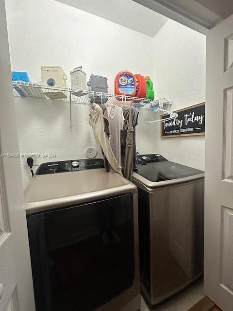 laundry room with electric dryer hookup and washer and dryer