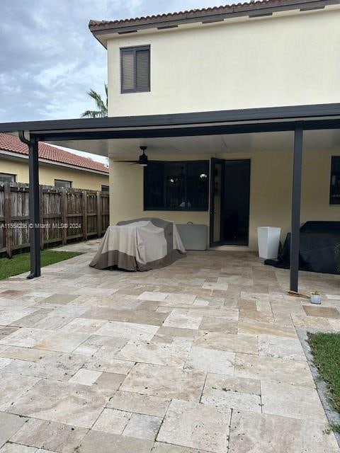 back of property with a patio