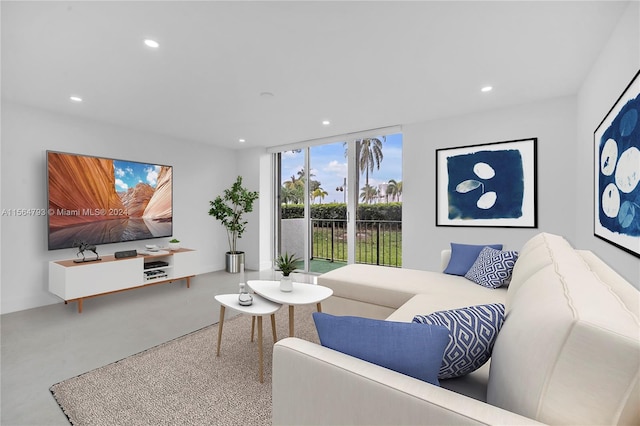 living room featuring floor to ceiling windows