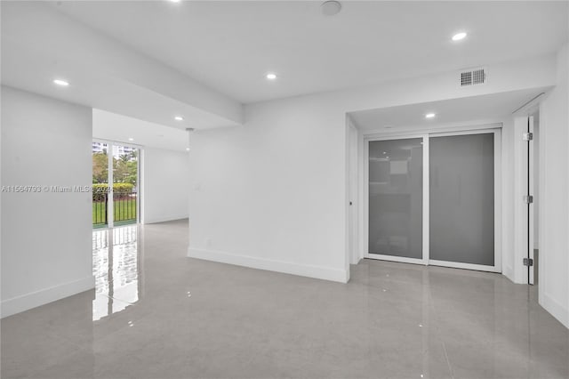 unfurnished room featuring tile flooring