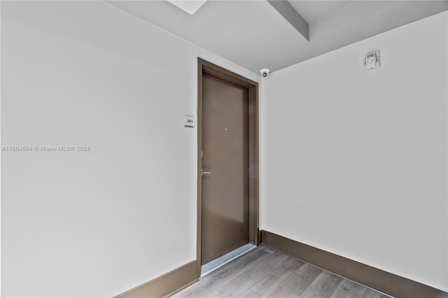 unfurnished room with light hardwood / wood-style flooring