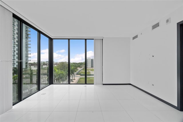 tiled empty room with expansive windows