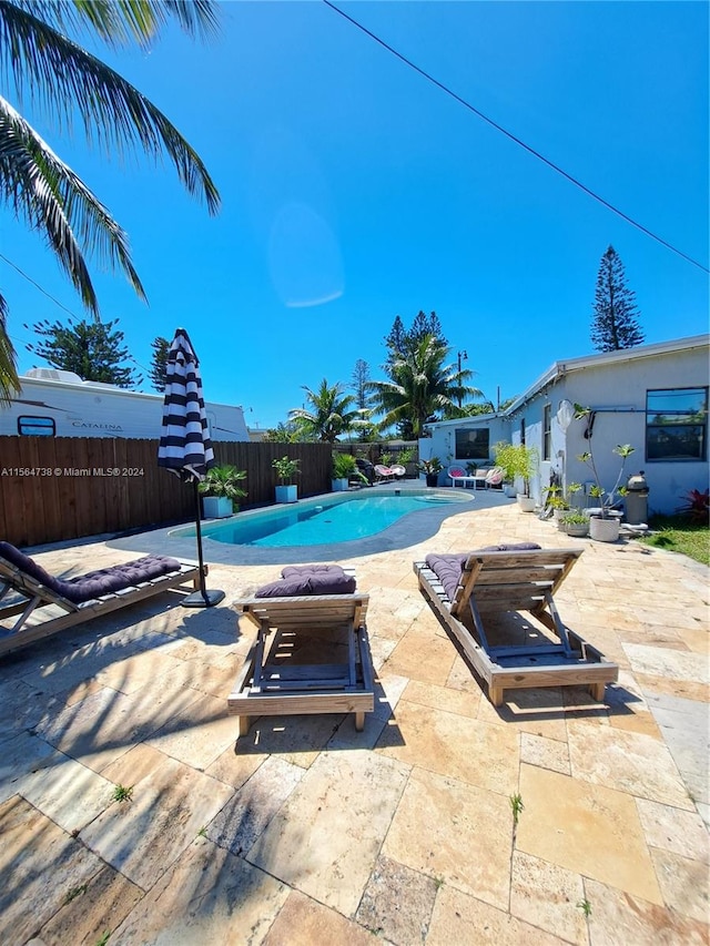 view of pool featuring a patio