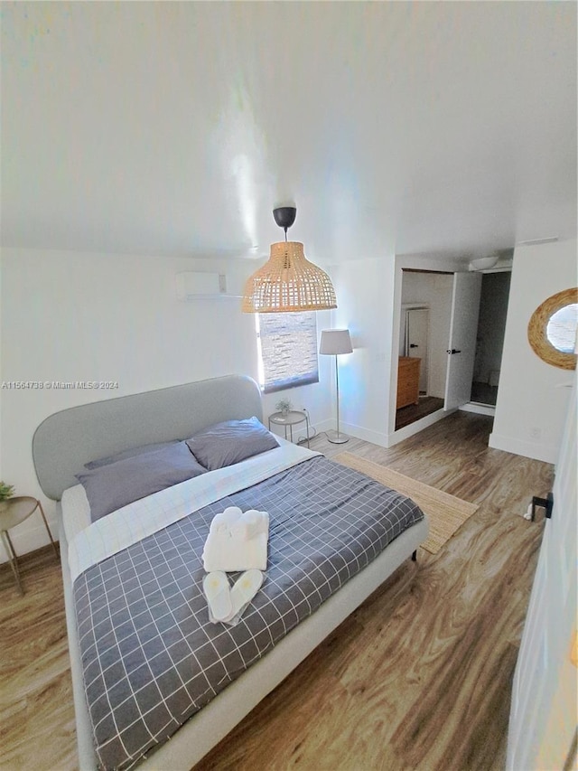 bedroom with light hardwood / wood-style flooring