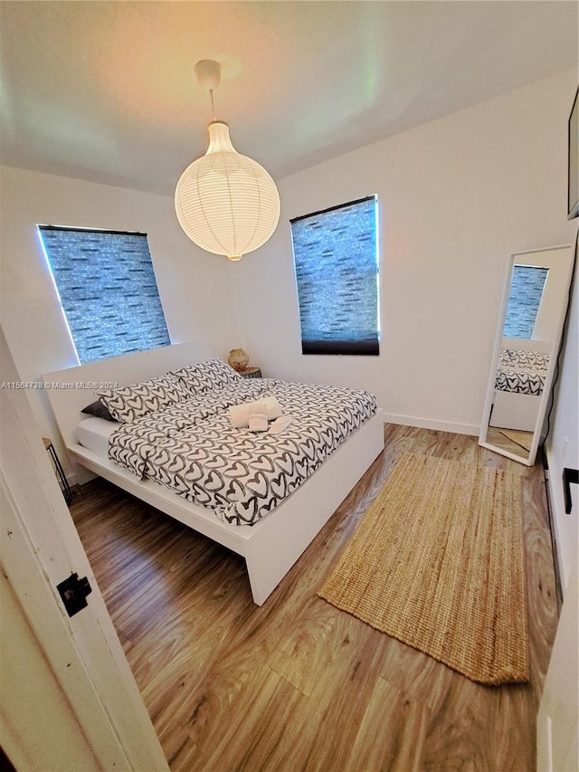 bedroom with hardwood / wood-style flooring