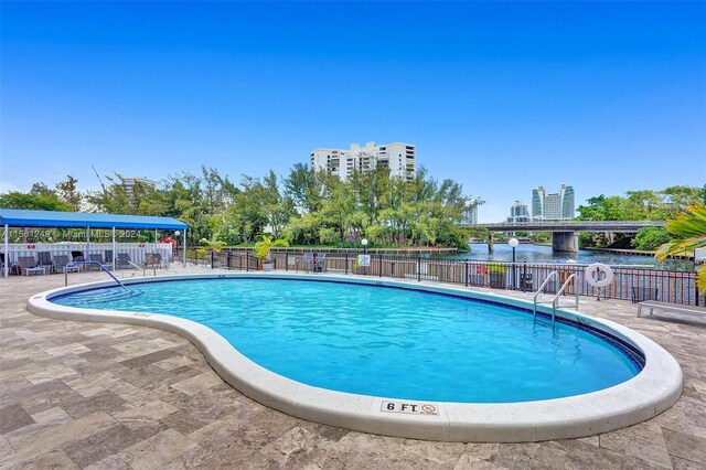 view of swimming pool with a patio area