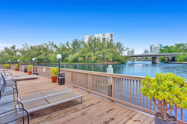 wooden deck featuring a water view