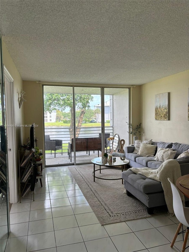 tiled living room featuring expansive windows and a wealth of natural light