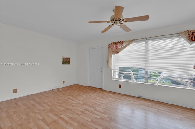 unfurnished room with ceiling fan and light hardwood / wood-style flooring