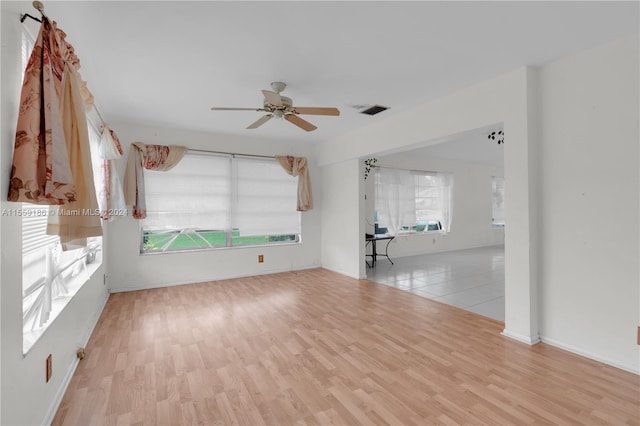 unfurnished room featuring ceiling fan and light hardwood / wood-style flooring