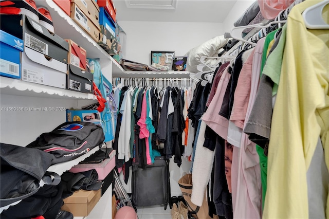 spacious closet featuring tile patterned floors