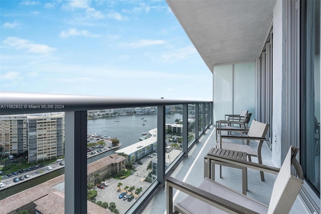 balcony featuring a water view