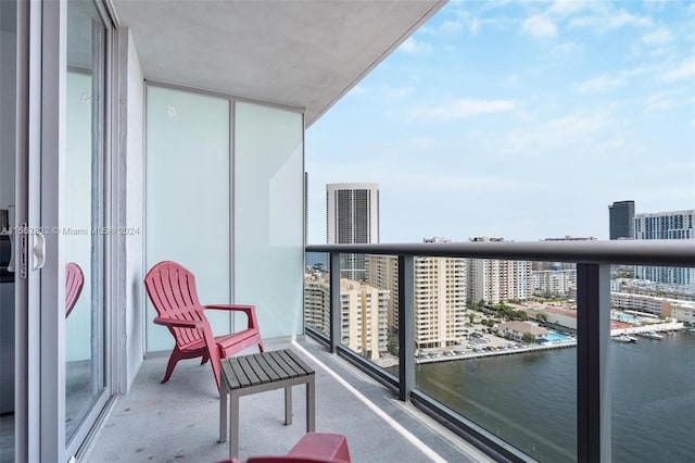 balcony featuring a water view