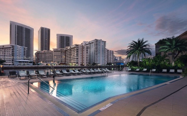 view of pool at dusk