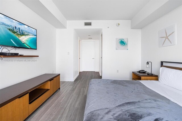 bedroom featuring dark hardwood / wood-style floors