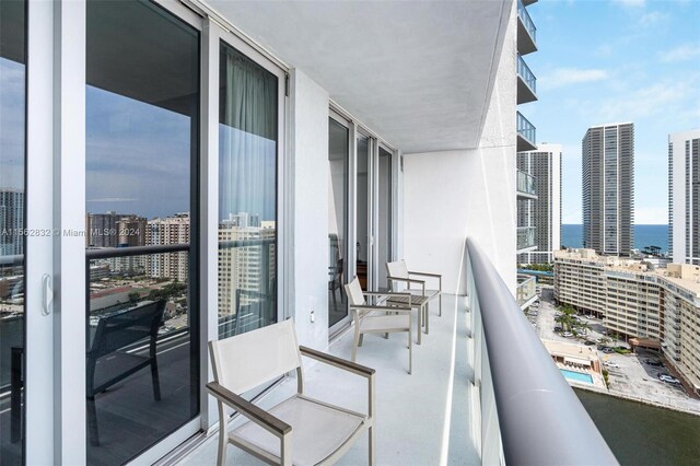 balcony featuring a water view