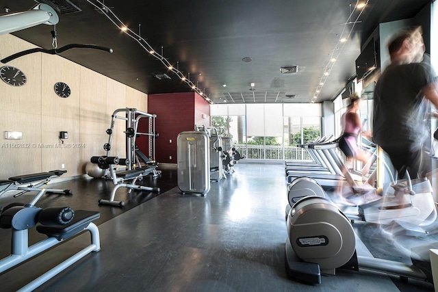 workout area with floor to ceiling windows