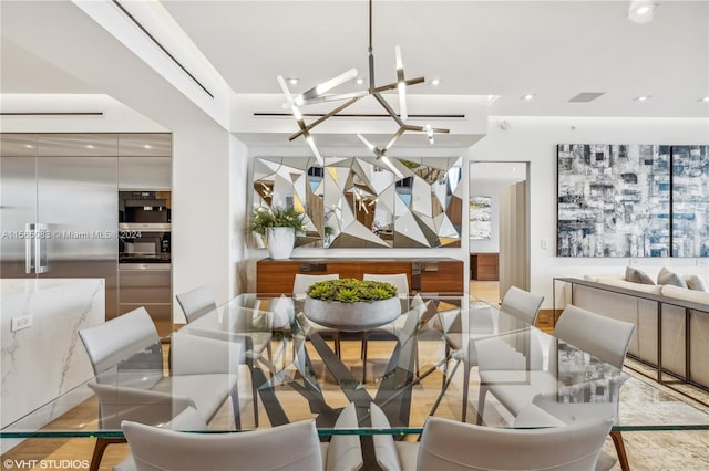 dining space with a chandelier