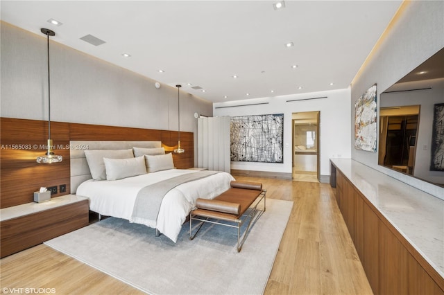 bedroom with light wood-type flooring